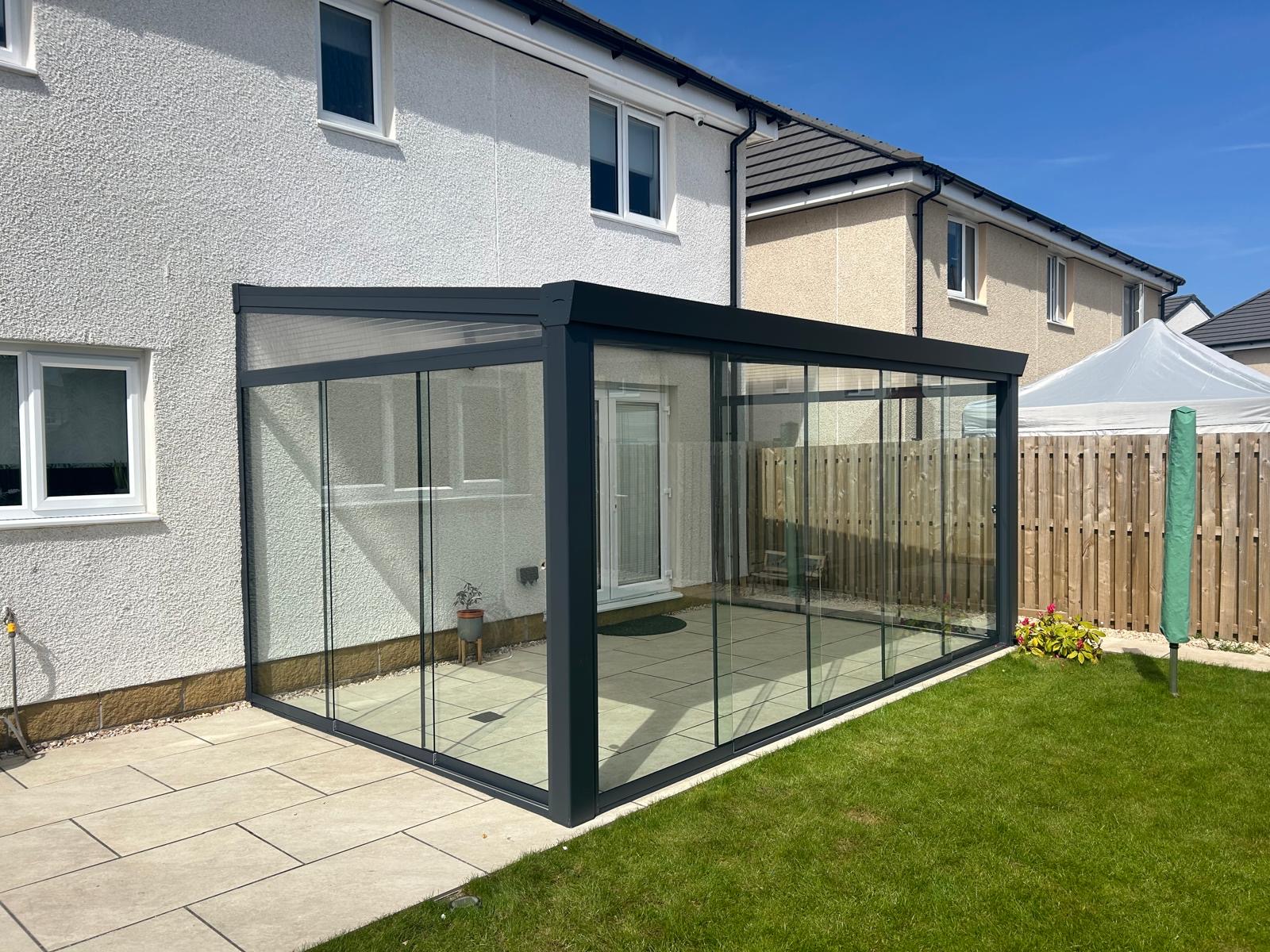 Add Space and Light with a Modern Glass Room